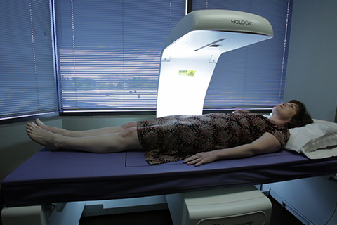 Woman getting a bone densitometry exam