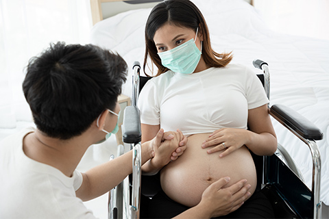 Pregnant woman in wheelchair