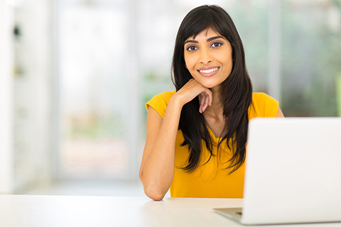 Indian woman on computer