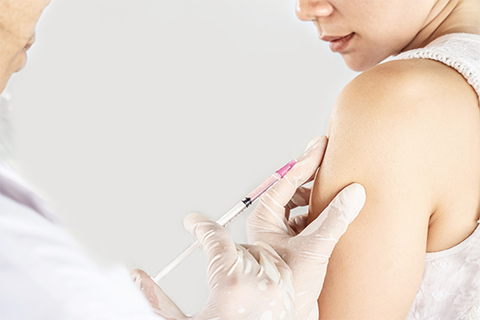 Woman getting a HPV vaccine